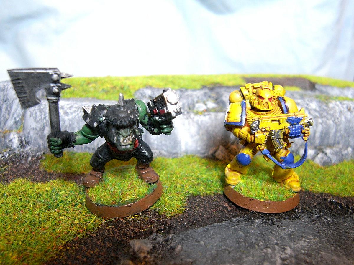 a Ork Boy and a Imperial Guns Space Marine