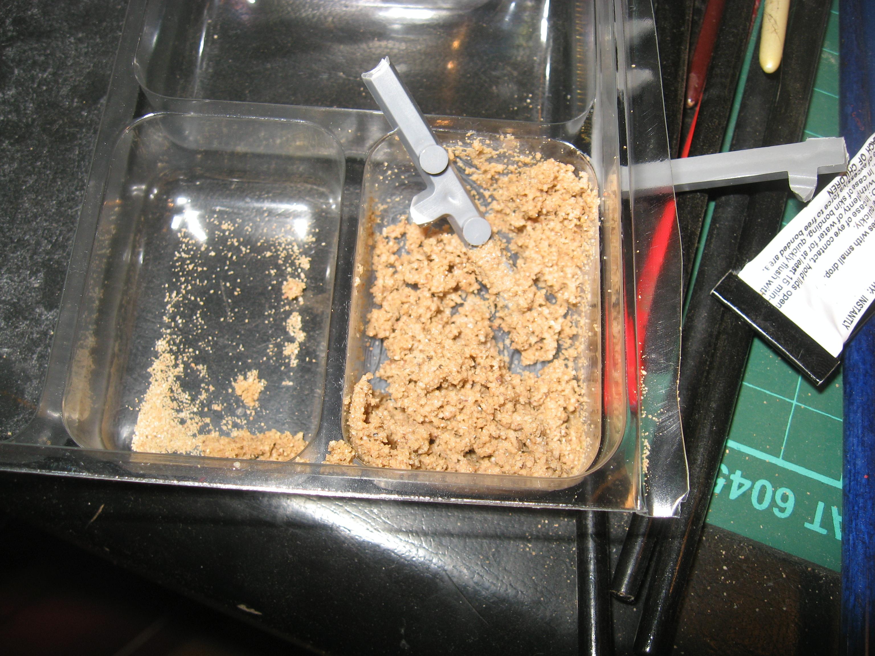here is modelling sand and PVA glue, this will be used to make the burrow on the base