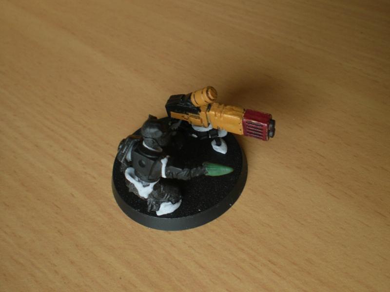 Tau and weapon on the same base