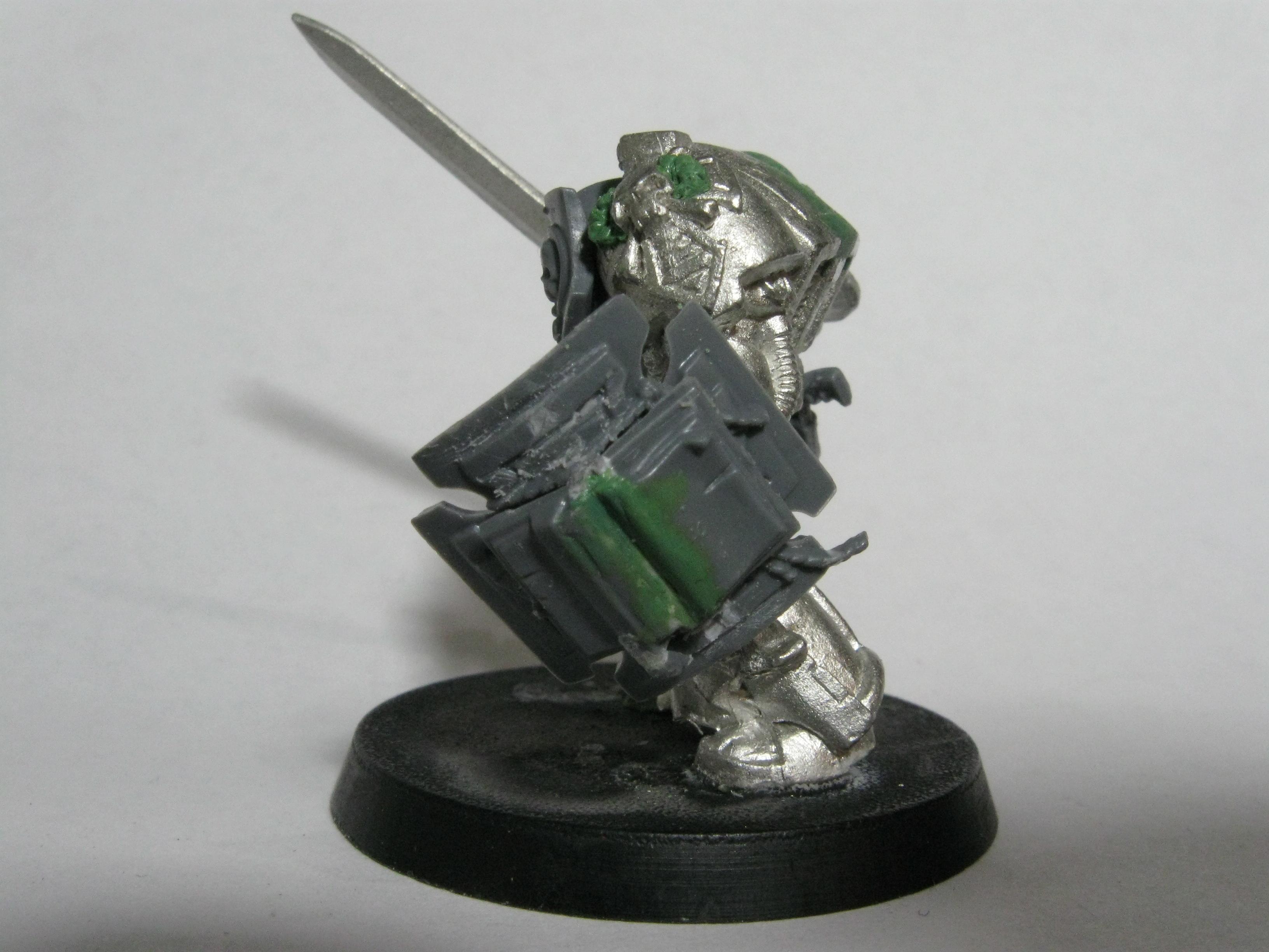 Here is the storm shield with his book. The DA symbol was shaved off the shield and the book glued to cover all the scratches. 