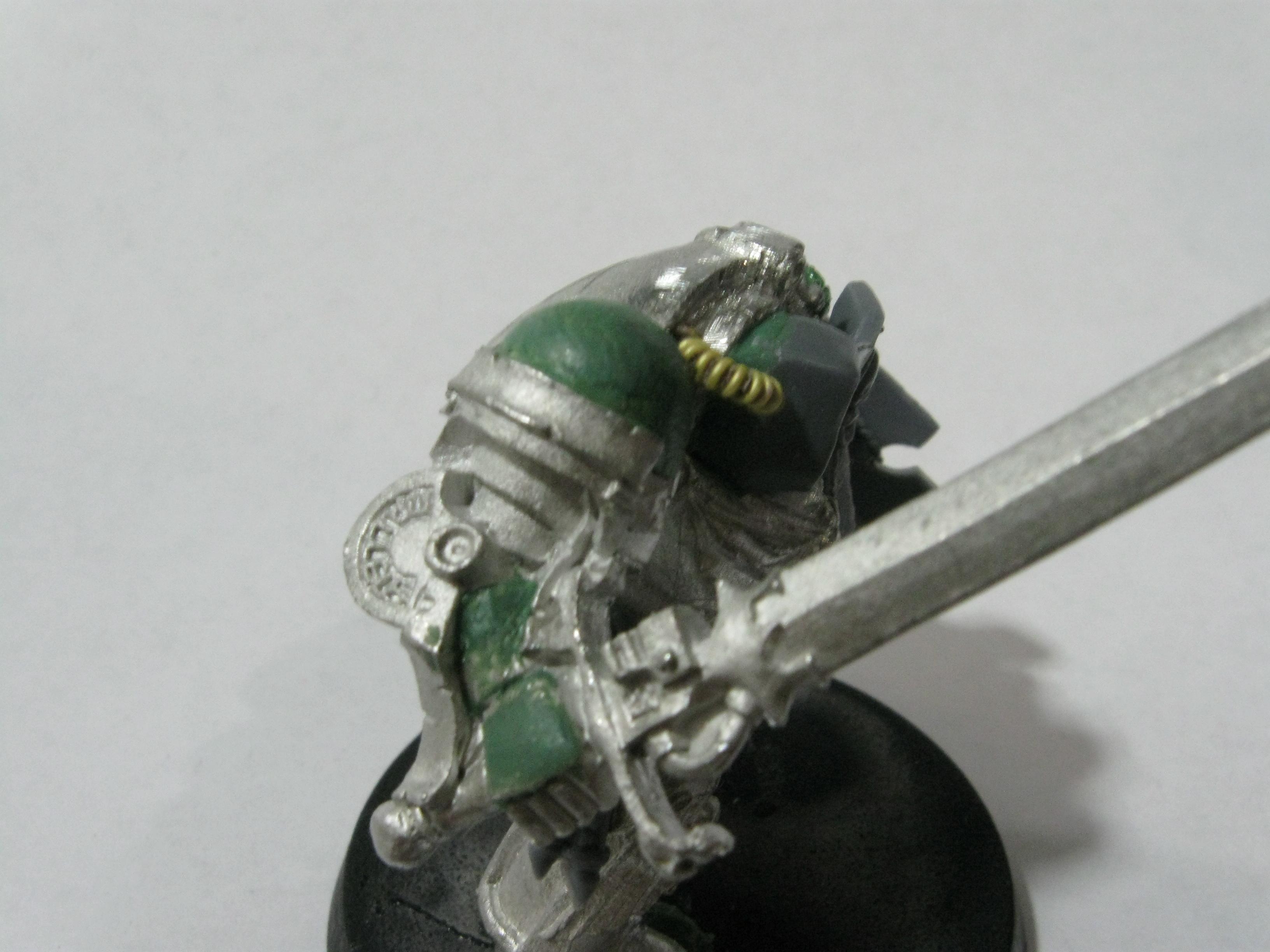 Here is the grey knight arm with the extra gaurd snipped off the top and smoothened out with green stuff