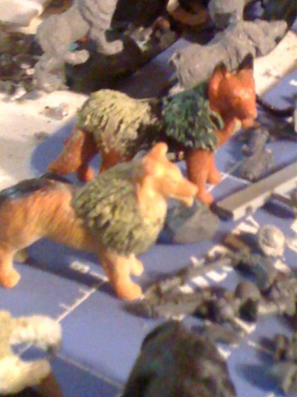 some wolf or dog figures my son had..seing if green stuff would bulk them up