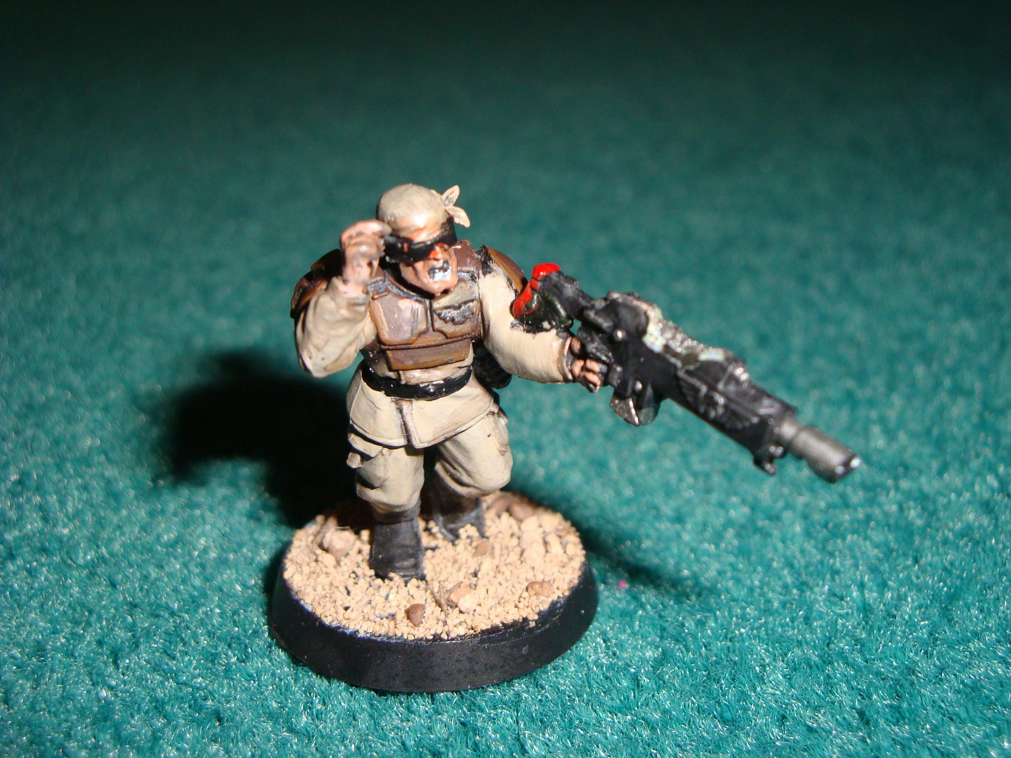 This model has a catachan head with a raised arm from the vox caster its gun is minorly converted to fit the laspistol hand