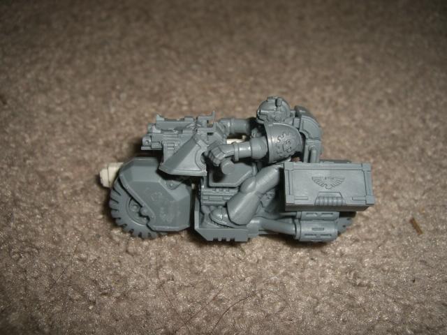 Left side with toolbox to help counter the gun's weight and I just like the idea of a non servo having MoTF  having to carry one around