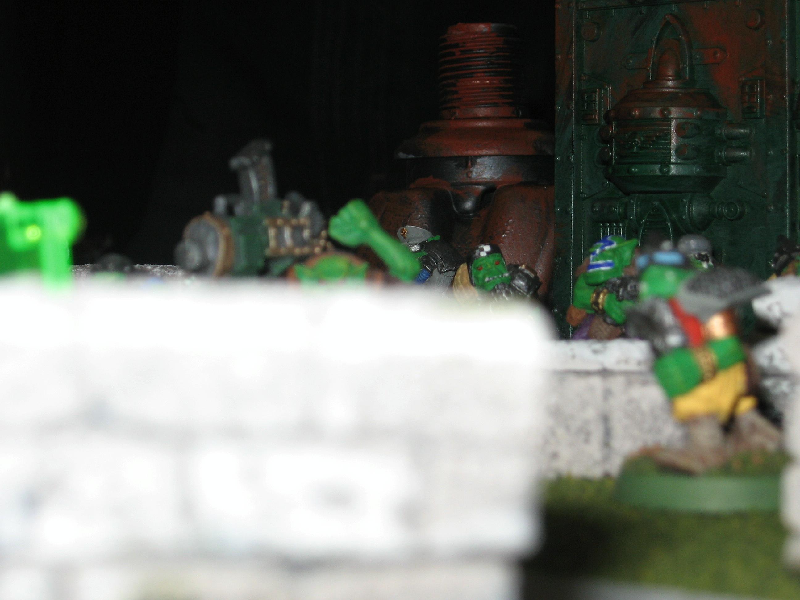 Orks hundle behind stone walls