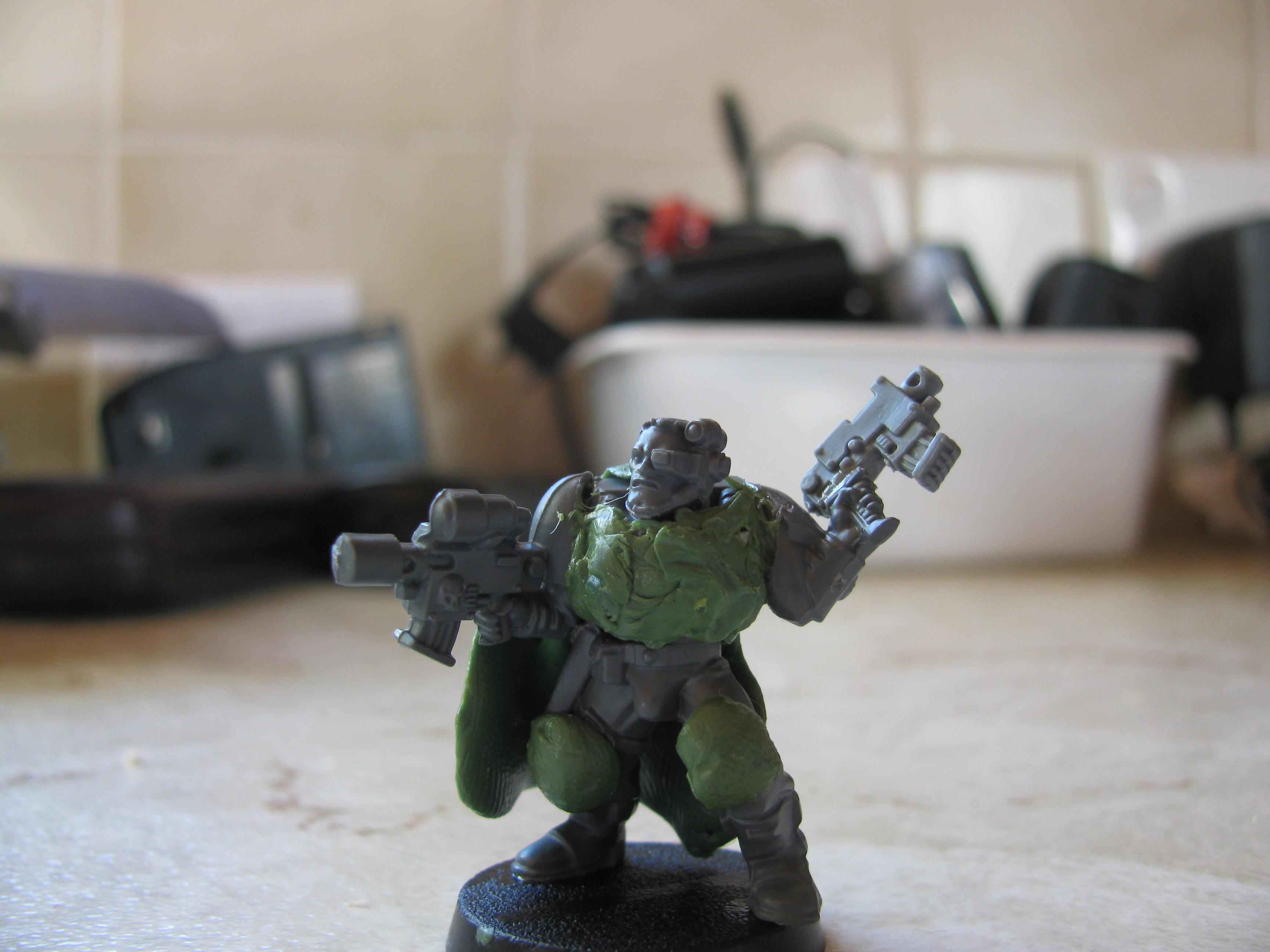 cowbot style ganger with 2 boltpistols and carapace armour