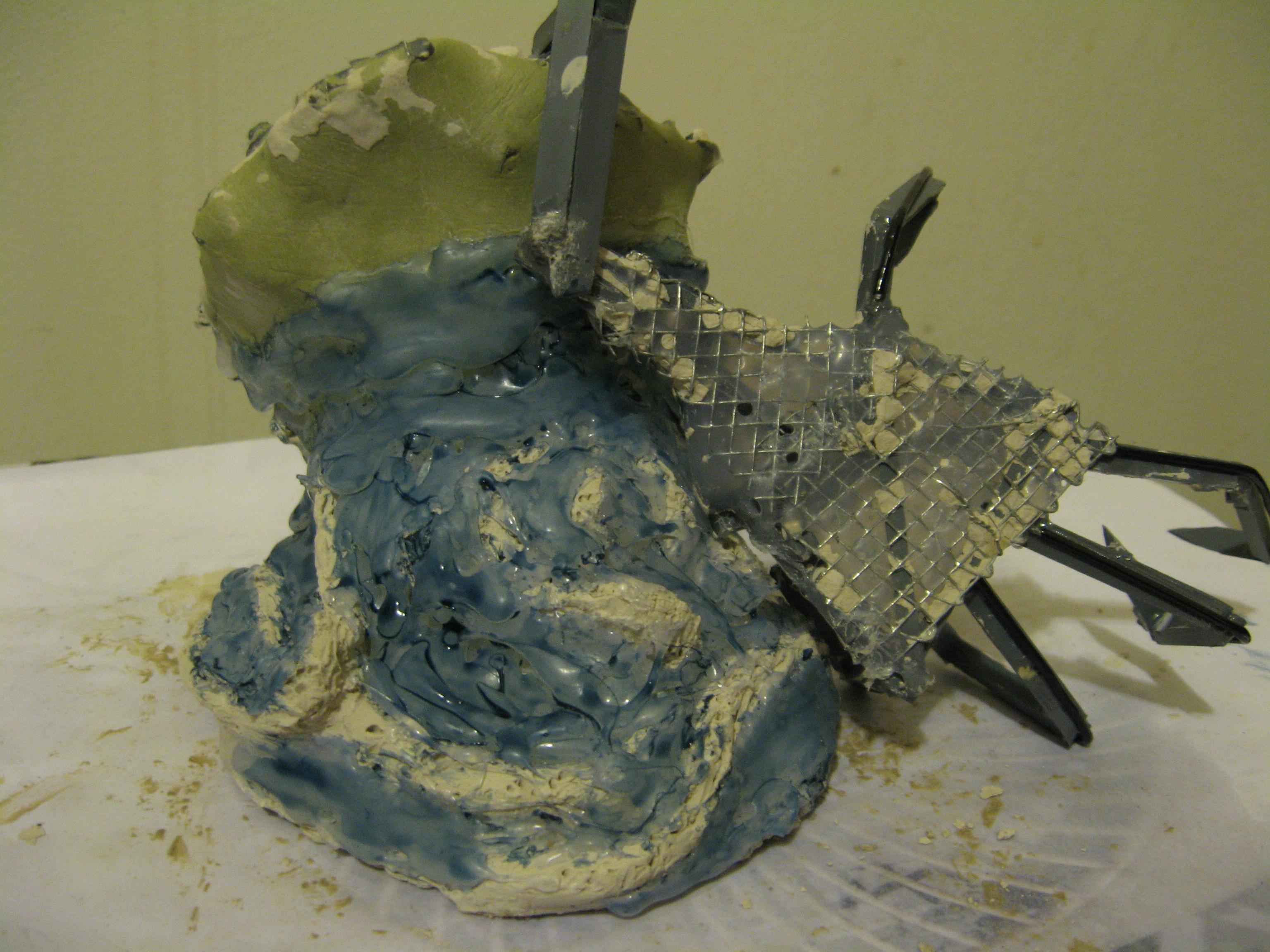 Fingers reinforced with coated paper clips, then "melted" into the plastic (it's rubber coating)