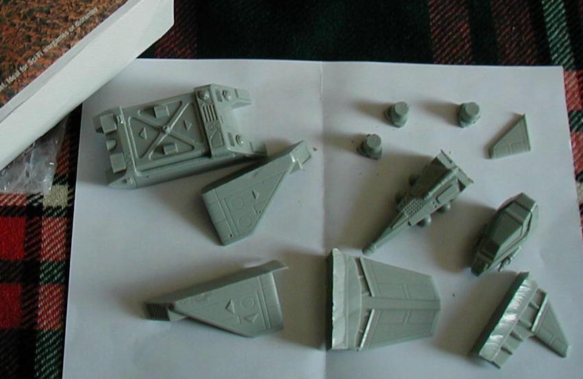 Talentless, here are the contents laid out for initial view. I cant see where the engine nozzles go. The resin was unwashed and slightly sticky. Better wash those handies