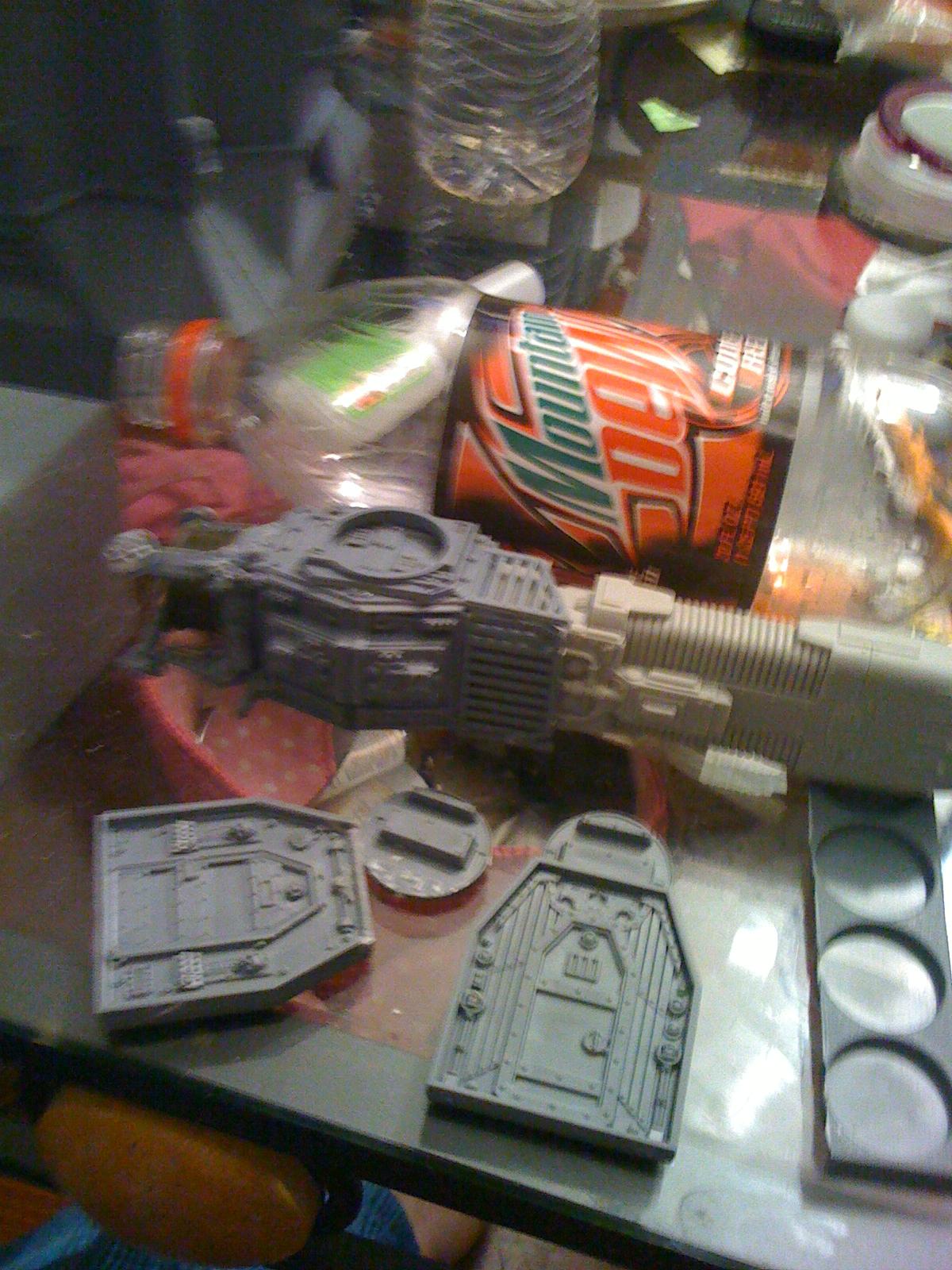 Using the doors i had left over i cut out a notch and using the round gun mounting disk for the interceptor cannons i made the hings for this beast