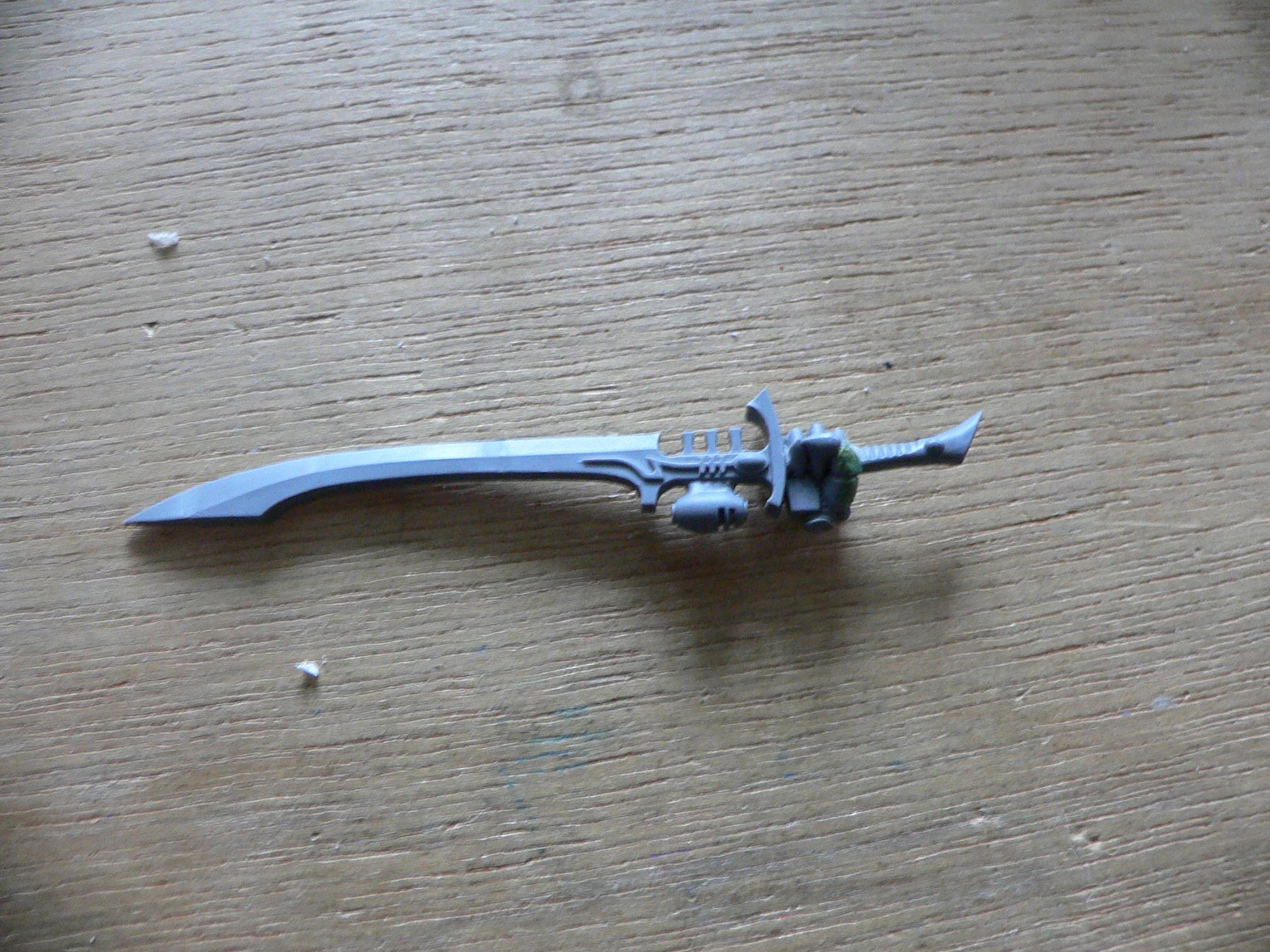The sword with the hand reversed