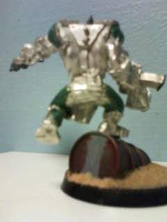 Ork Unpainted, i cut off both his legs to make it look like his jumping off the barrel