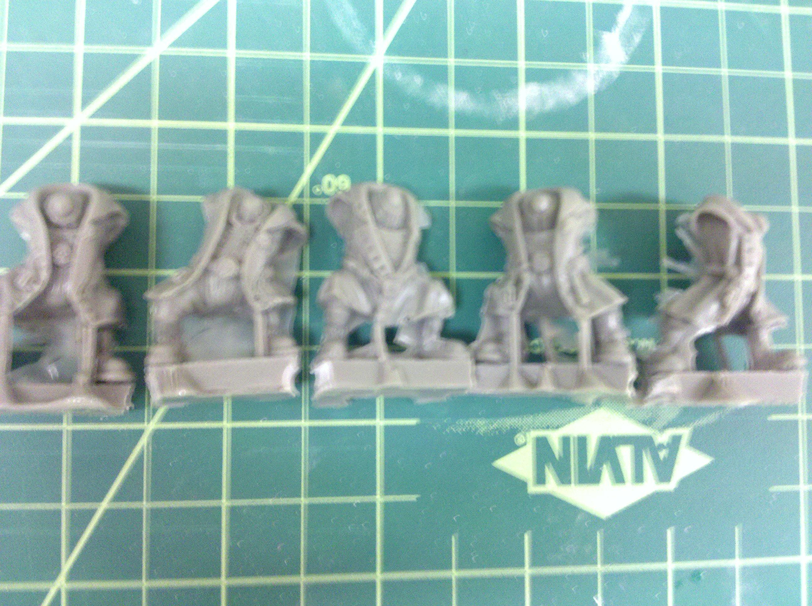 3rd Pack: Ork bodys with heavy armor in trenchcoats from micro art studios
