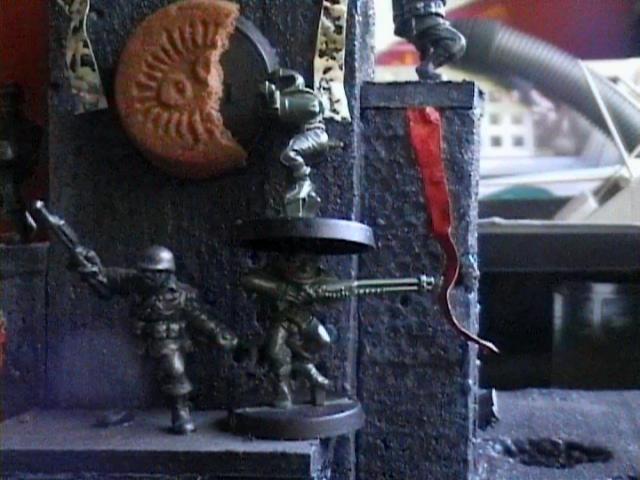 grotsnick and grotsnack eat the grimdark cookie monument