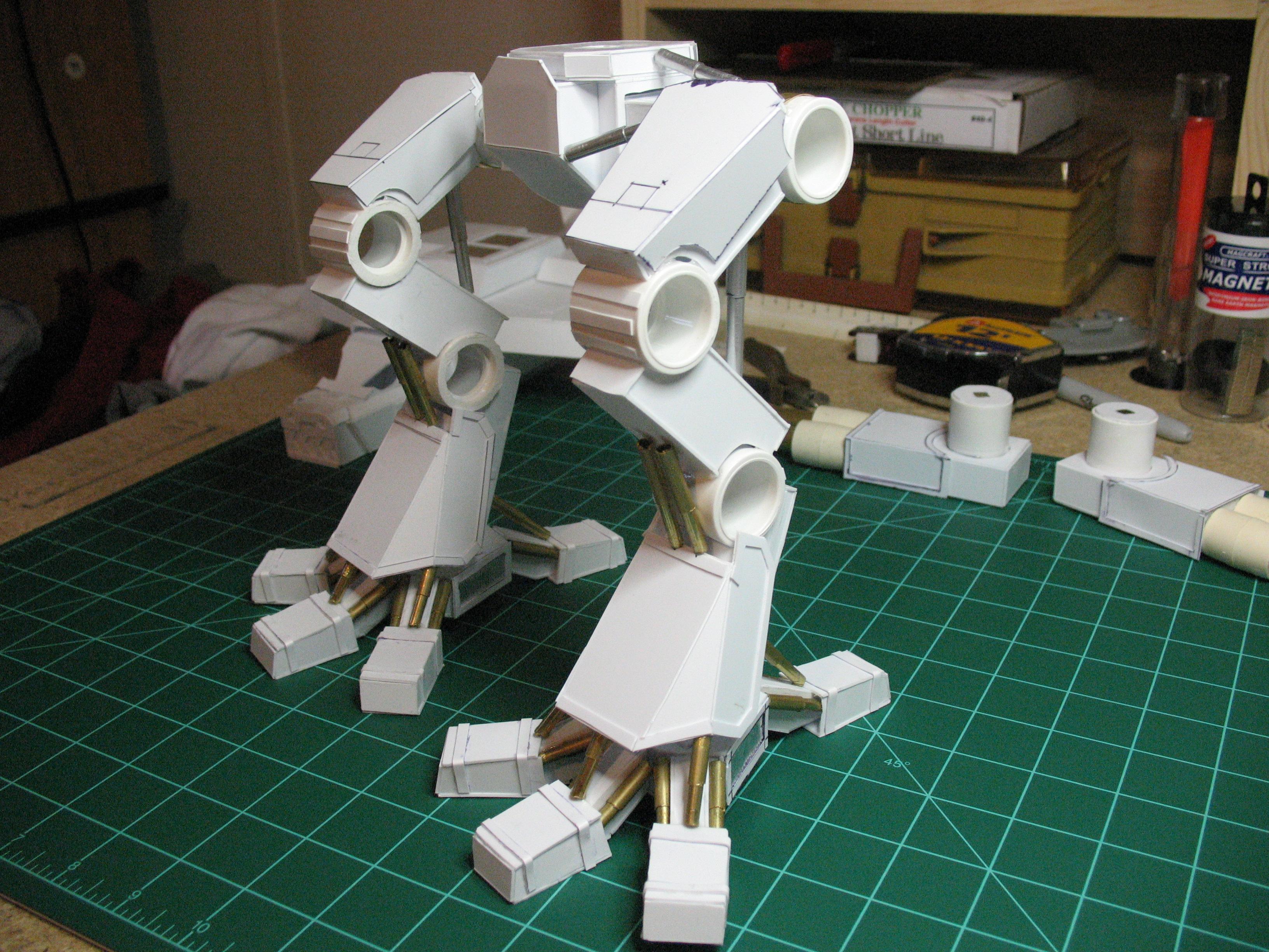 added some bands to the toes, upper thigh armor plates, trim to lower shin armor, all leg and hip pistons, little plates to the knees