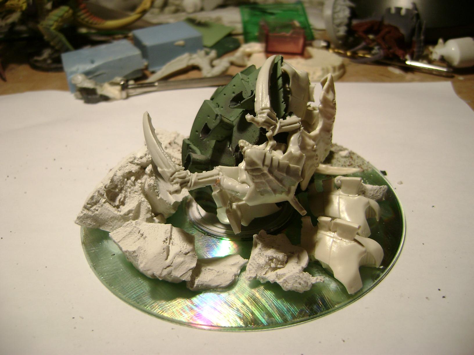 M spore with   warriors emerging  from it