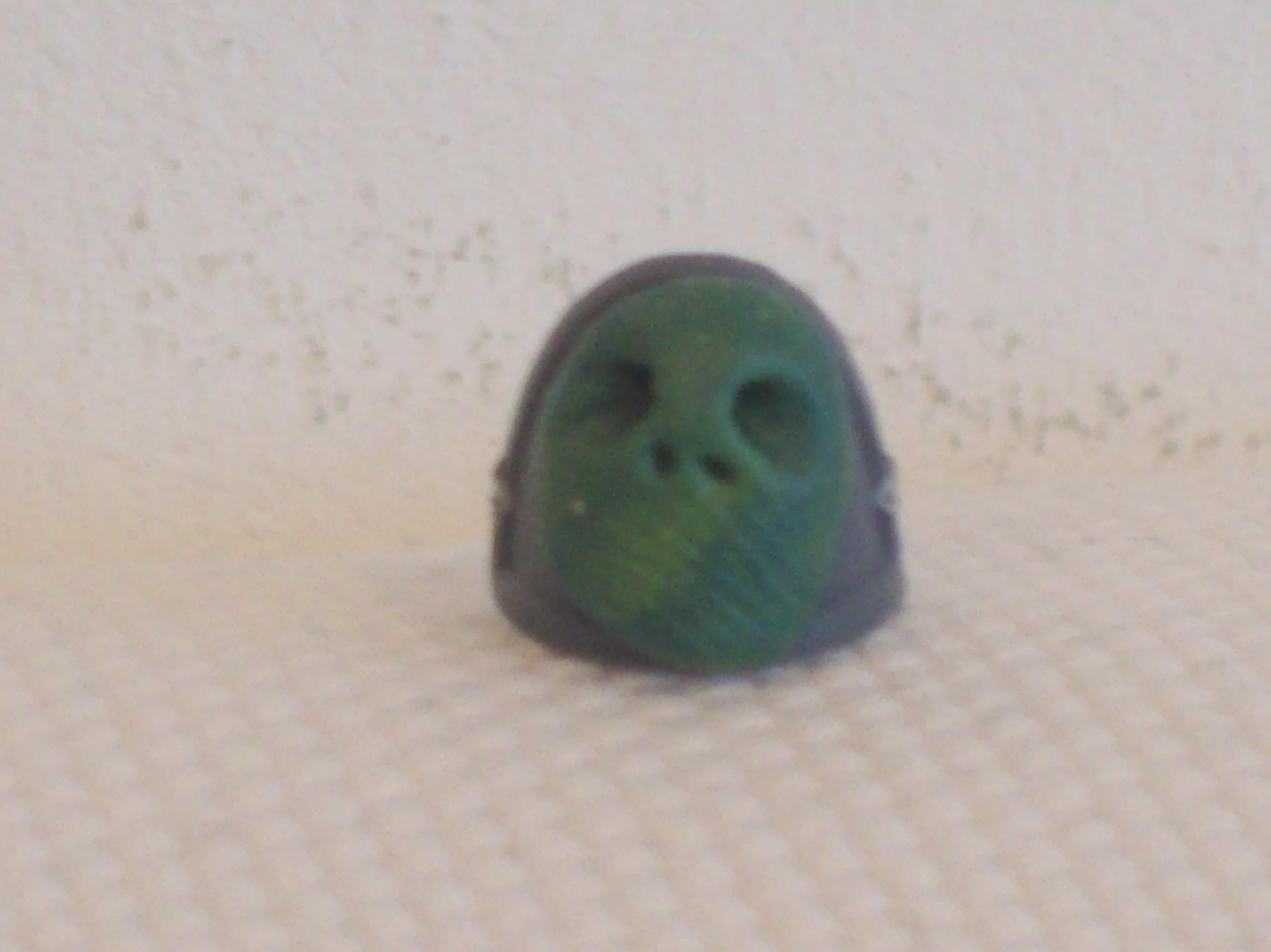 2.) Then sculpt two eye holes using the area between the point and diagonal side of an object like a cocktail stick, and also, just poke two nasal holes with the very point of the tool