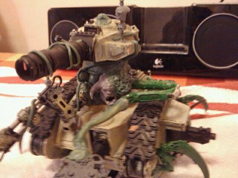 imperial guard tank converted to defiler using green stuff and some nid parts + oger head and killer can combat weapons