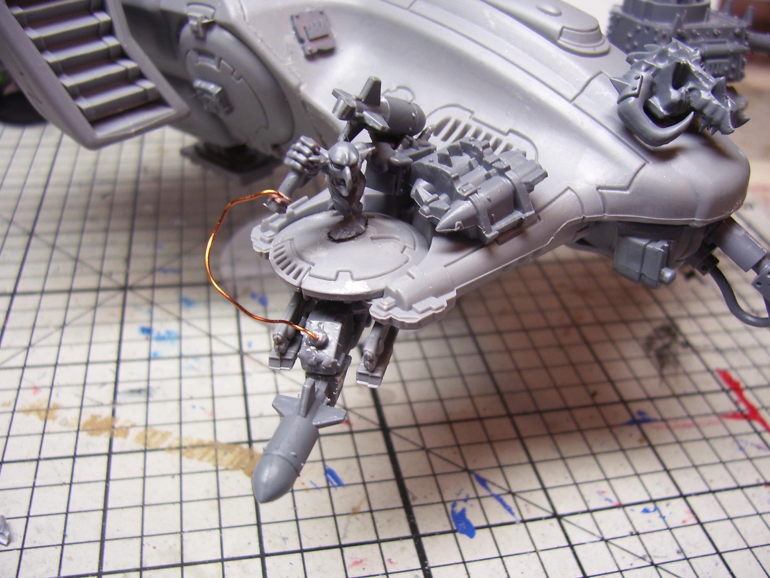 The rocket is fired manually by the grot. He has rockets beside him to reload the launcher