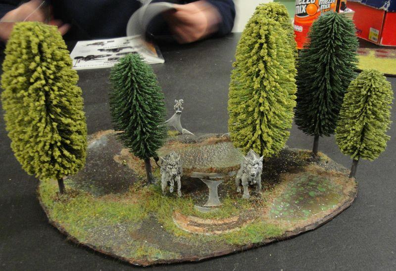 Some Forest, Some small pond, some Lions guarding it