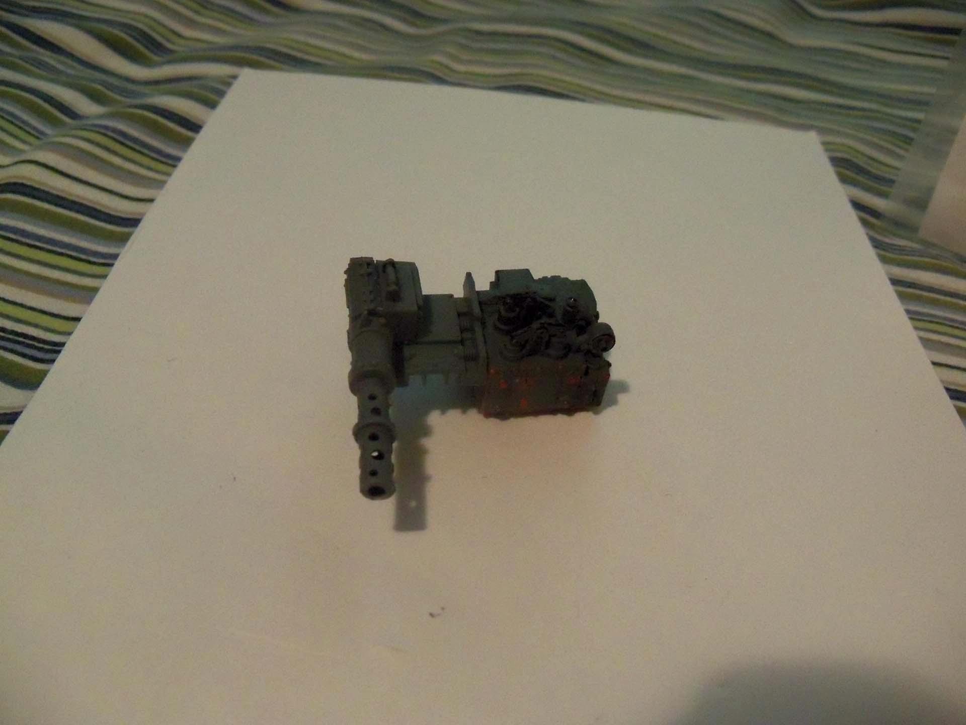 added the dakkacannon onto the engine. Used a space marine lascannon(probably from a vehicle) and the smoke stack from the wartrukk for the barrel