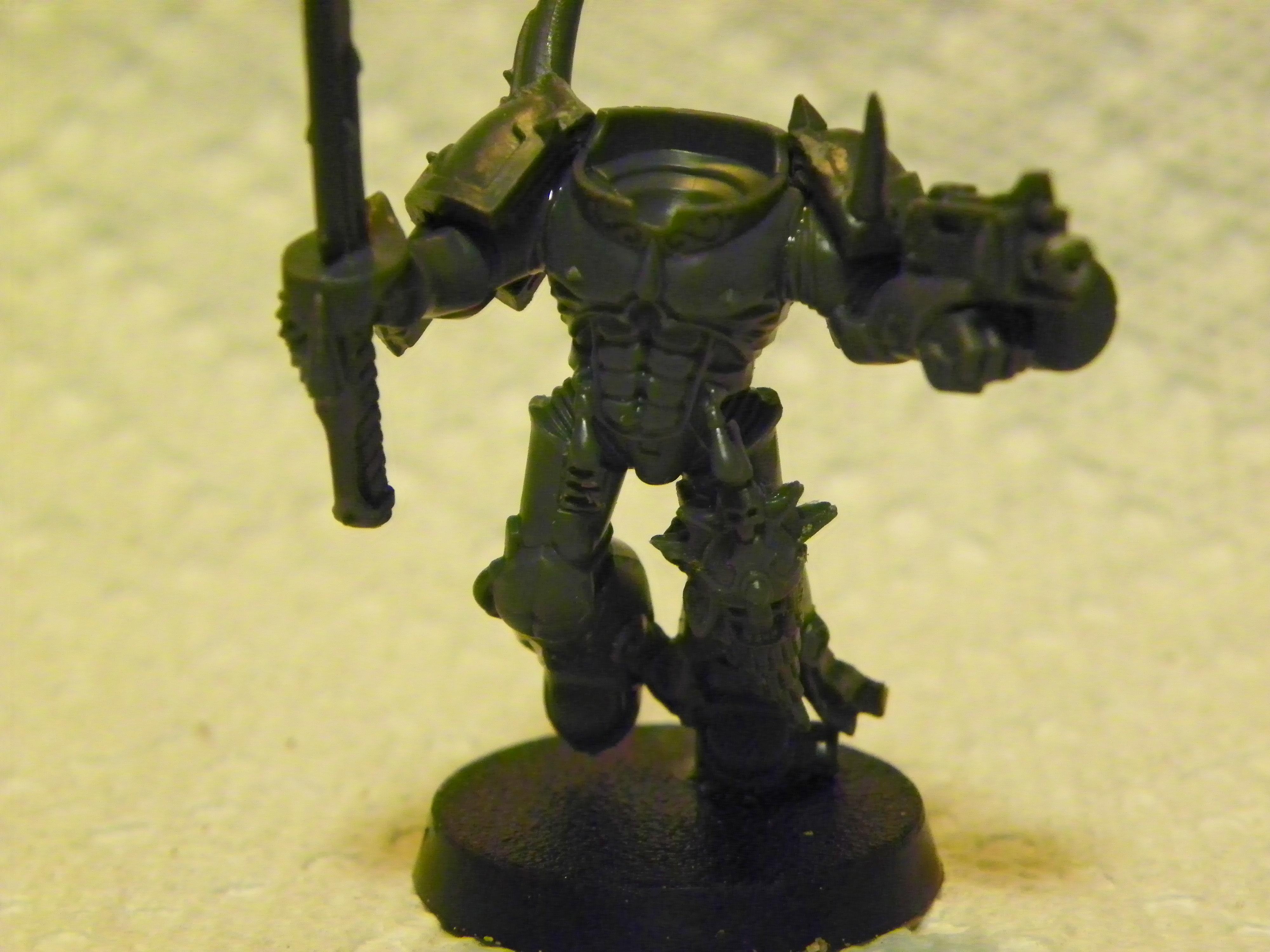 Obviously not done, but I wanted to show the new skull and helm on his knee. I shaved off the previous face and replaced it