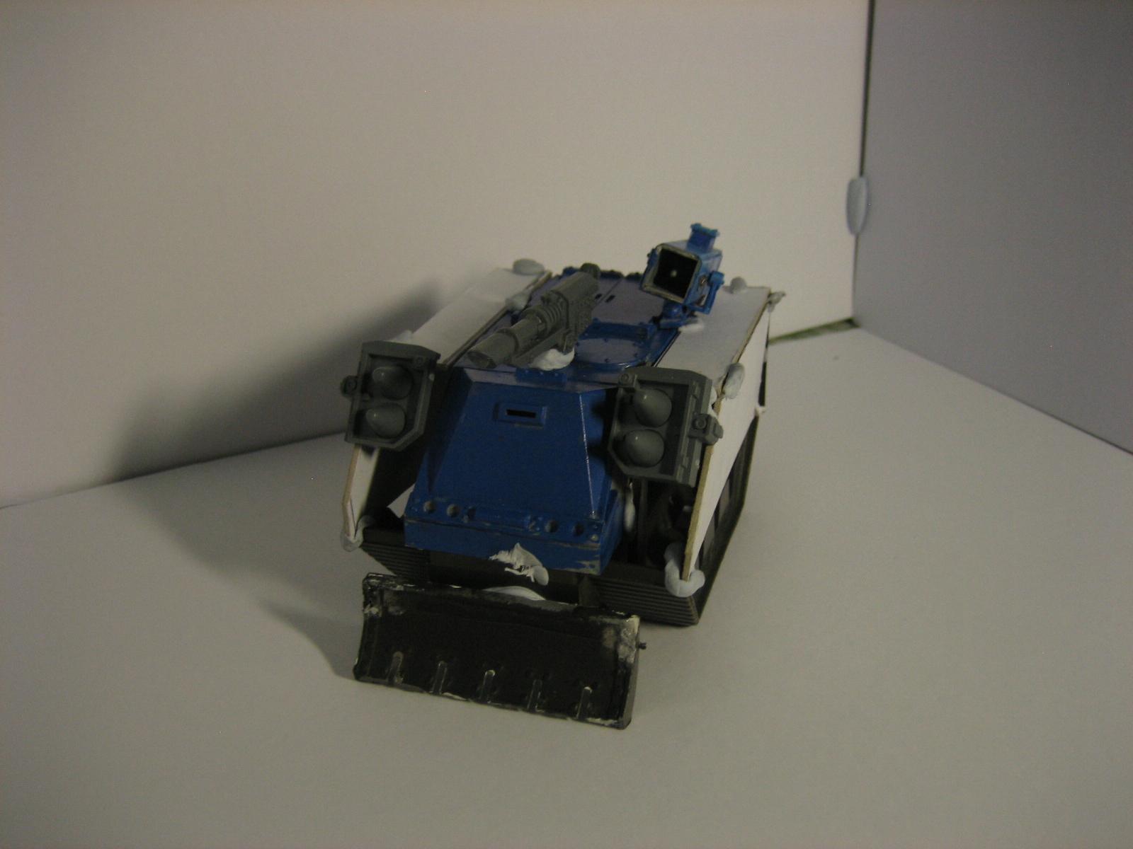 A salvaged vehicle. All bluetacked. Thinking of making it transport for my Tech Marines..