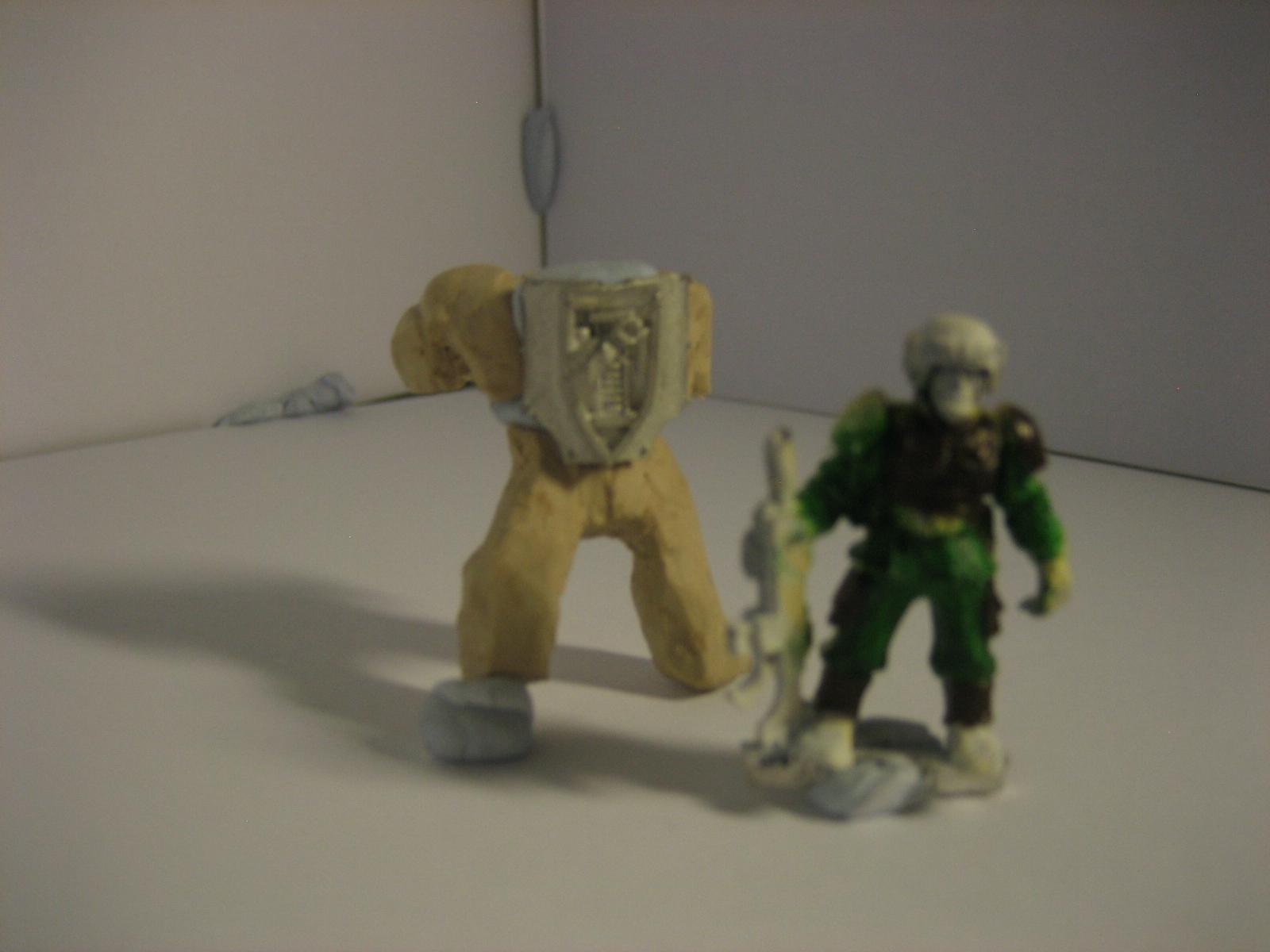 A size comparison. That guardmens was painted with felt tip a loooong time ago. I hang my head