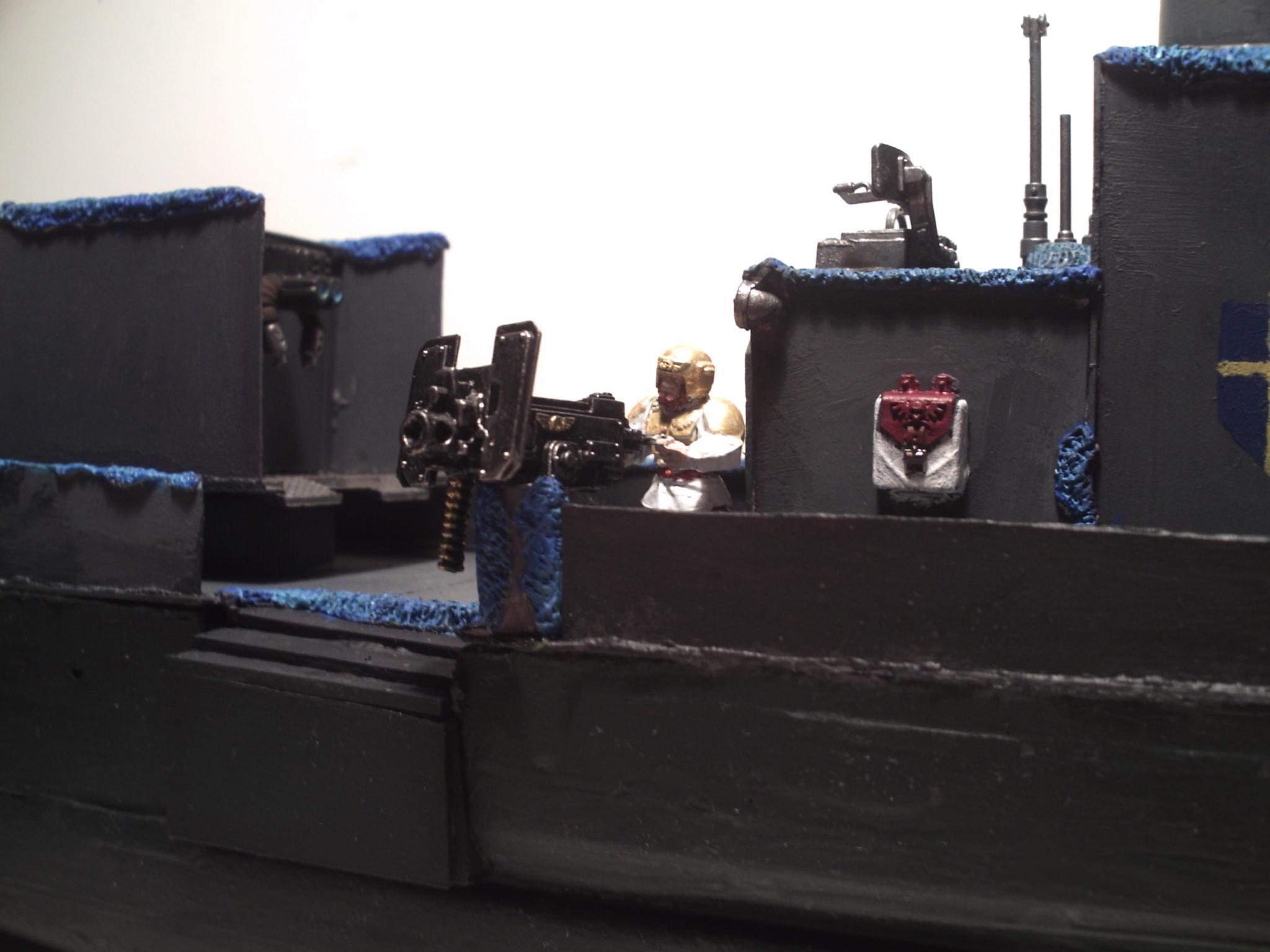 Starboard gunner with liferaft bag in background