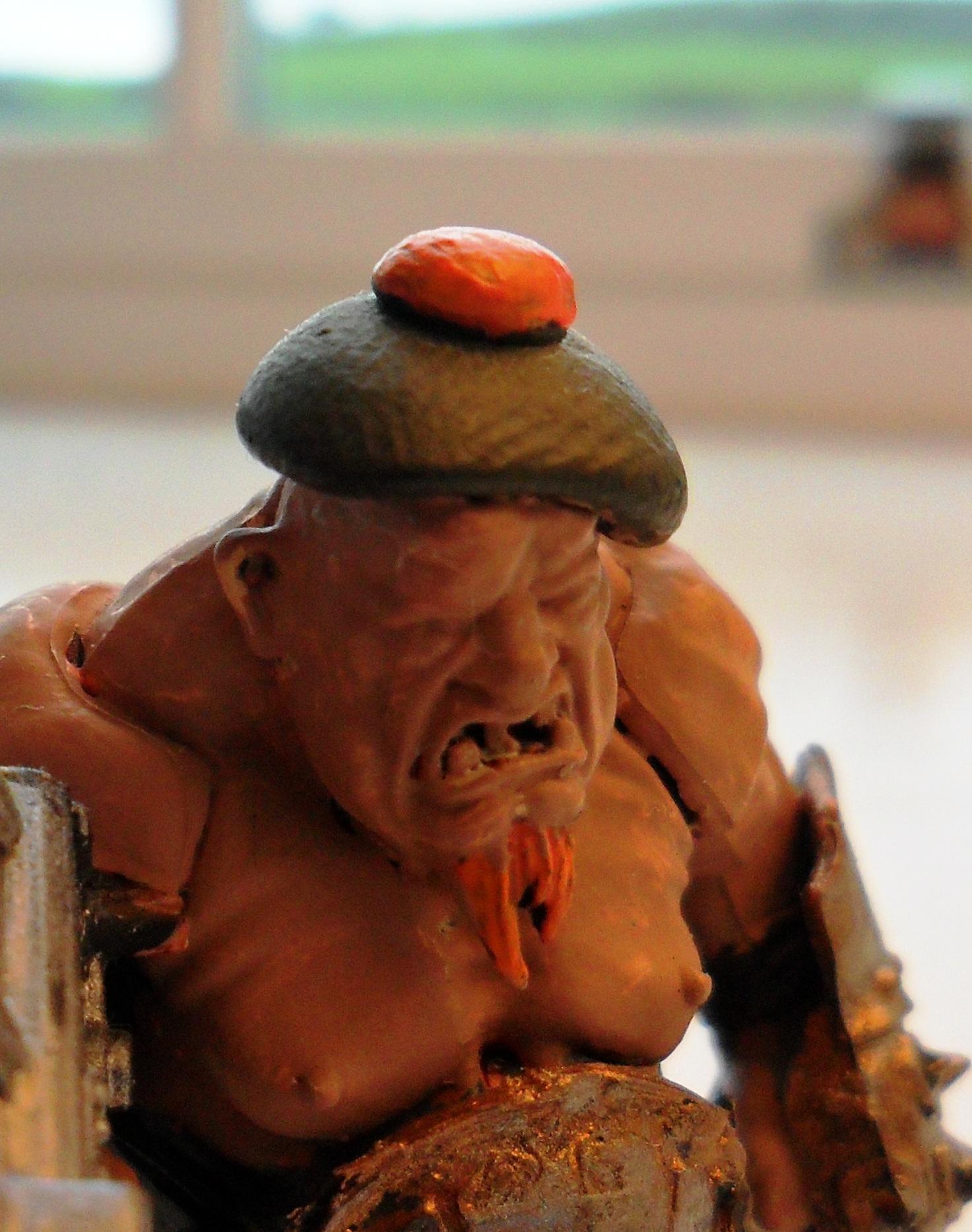 With his hat :D