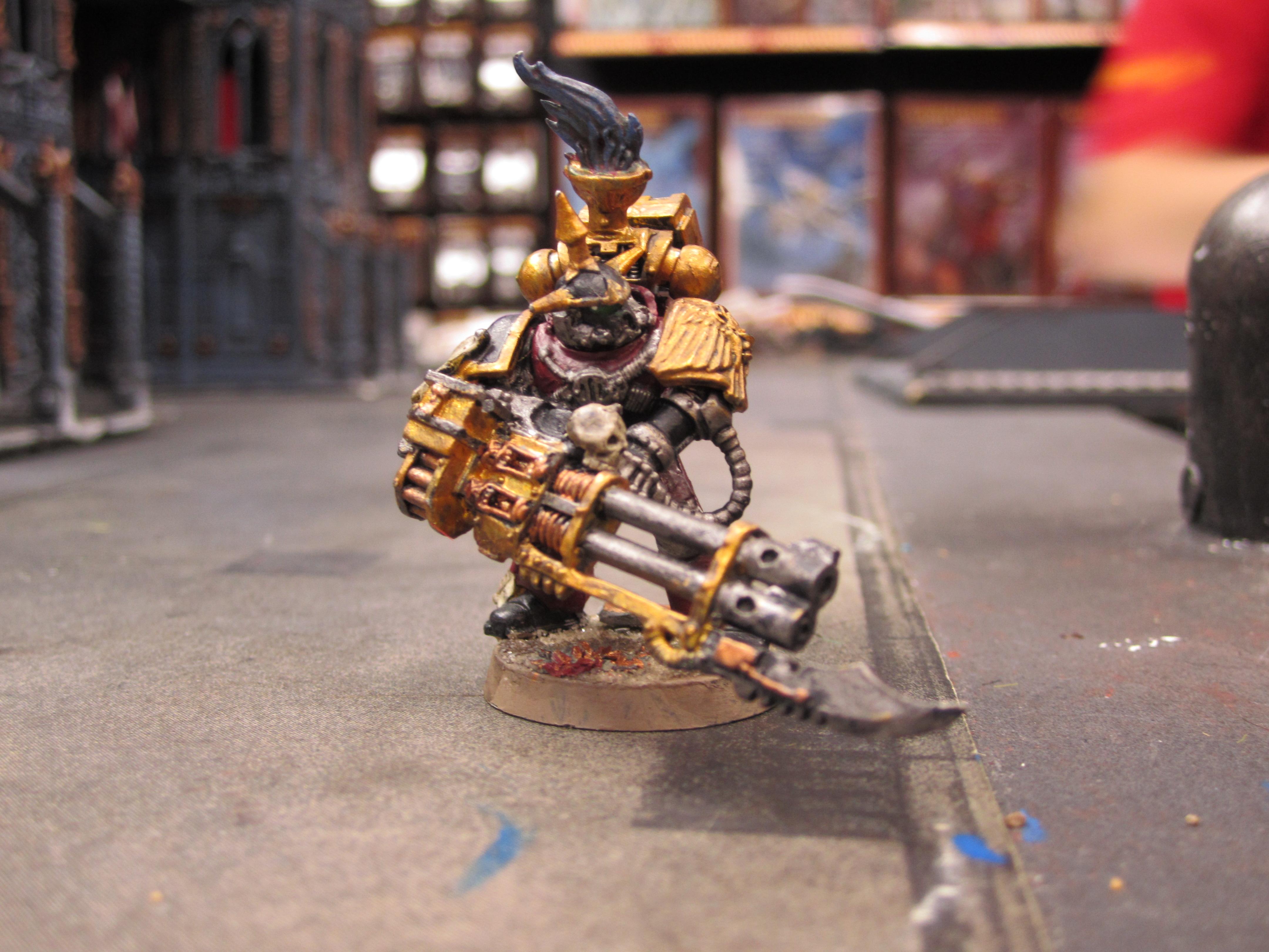 Autocannon guy! in the story of these chosen he took it off of a dead black legion Terminator, refurbished it and repainted it and it works more like a standard Atuocannon!