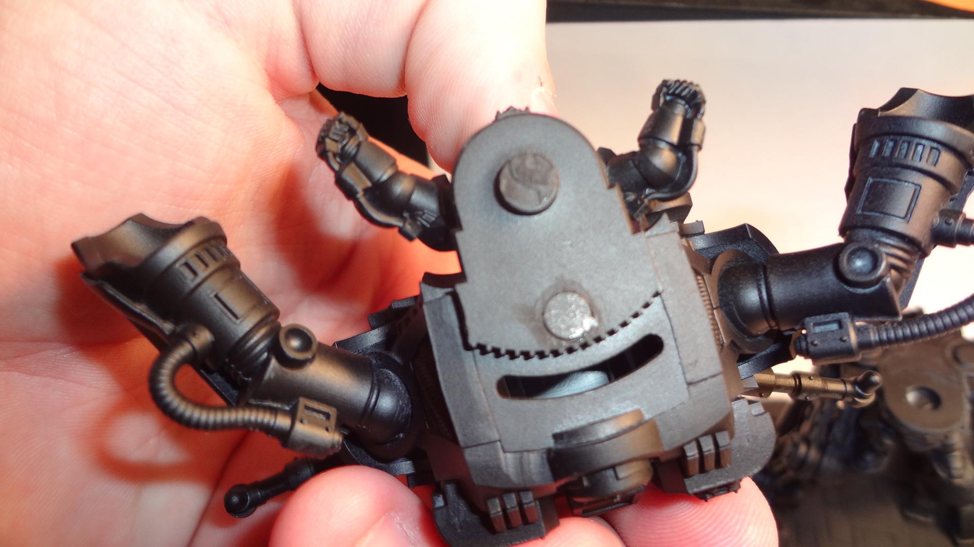 In an odd change of events, serves as a lock for the two pieces. Turn torso to left and it pops right off haha