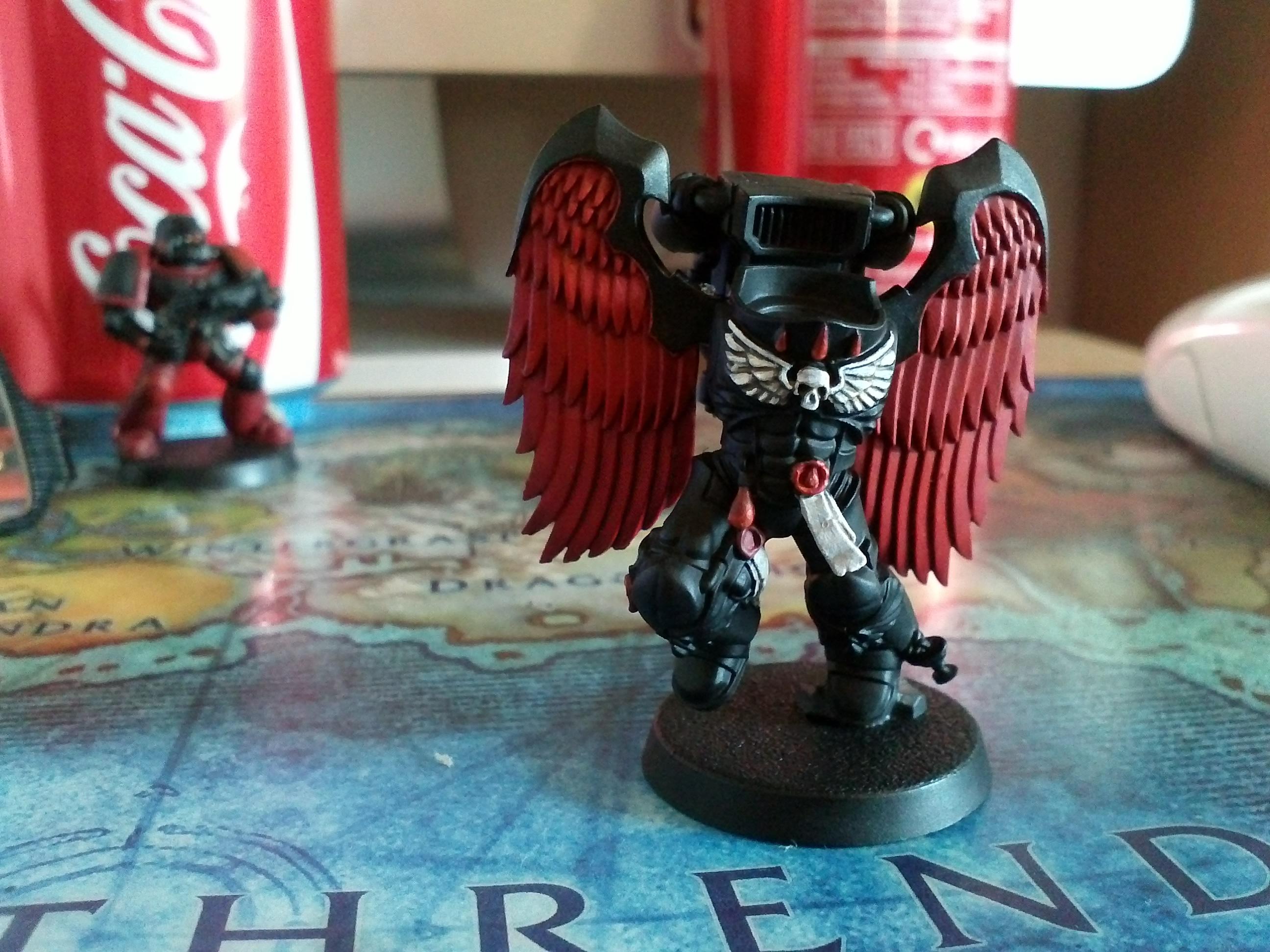 never again after a heavy night will i paint separate feathers on the chest skull