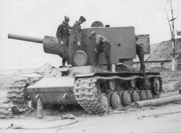 Abandoned KV - 2 bieng looked over by Germans