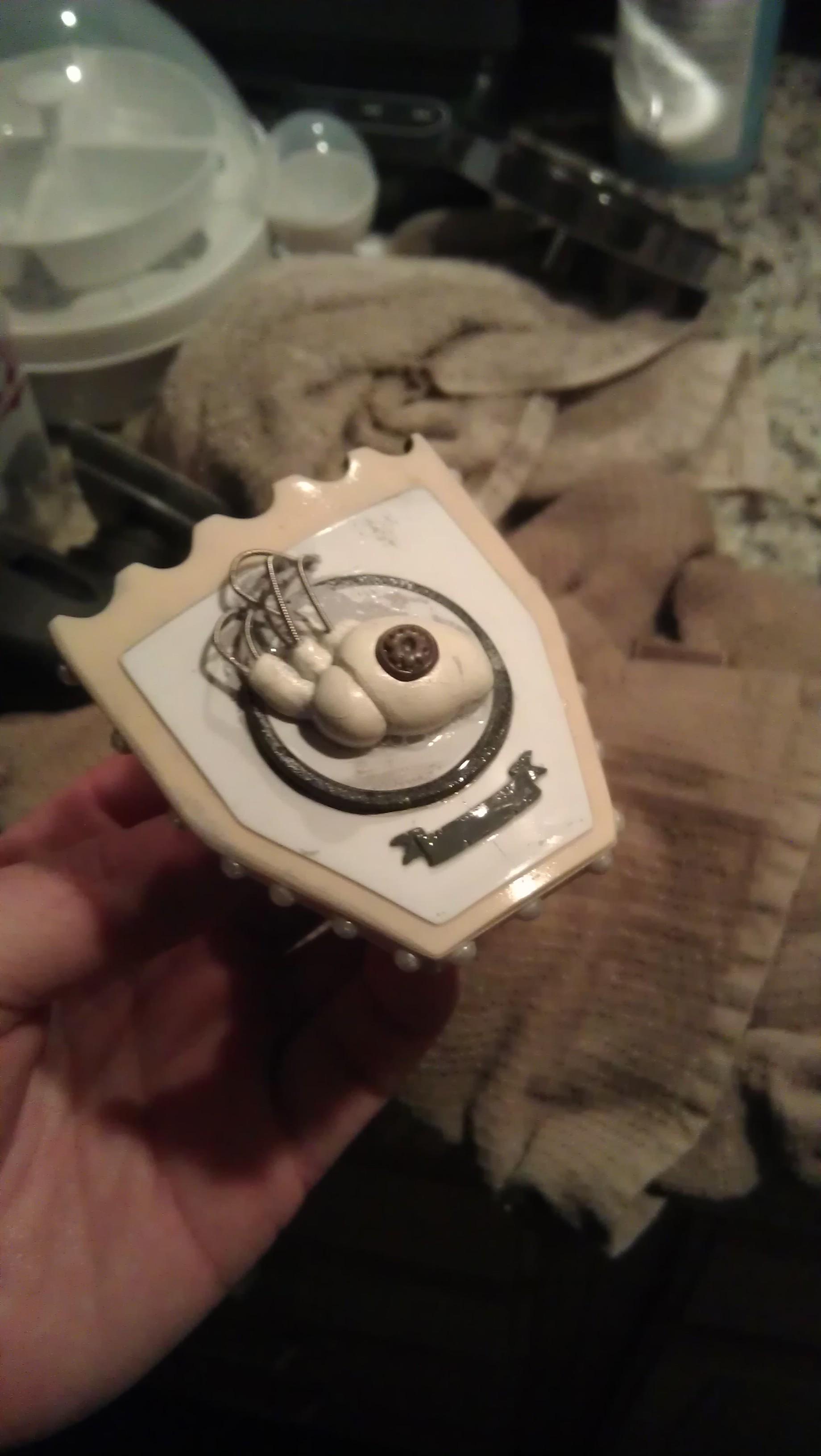 this is a symbol ive been dreamin up for a while. i sculpted the heart and added the mechanical bits and the cog to represent man and machine working together