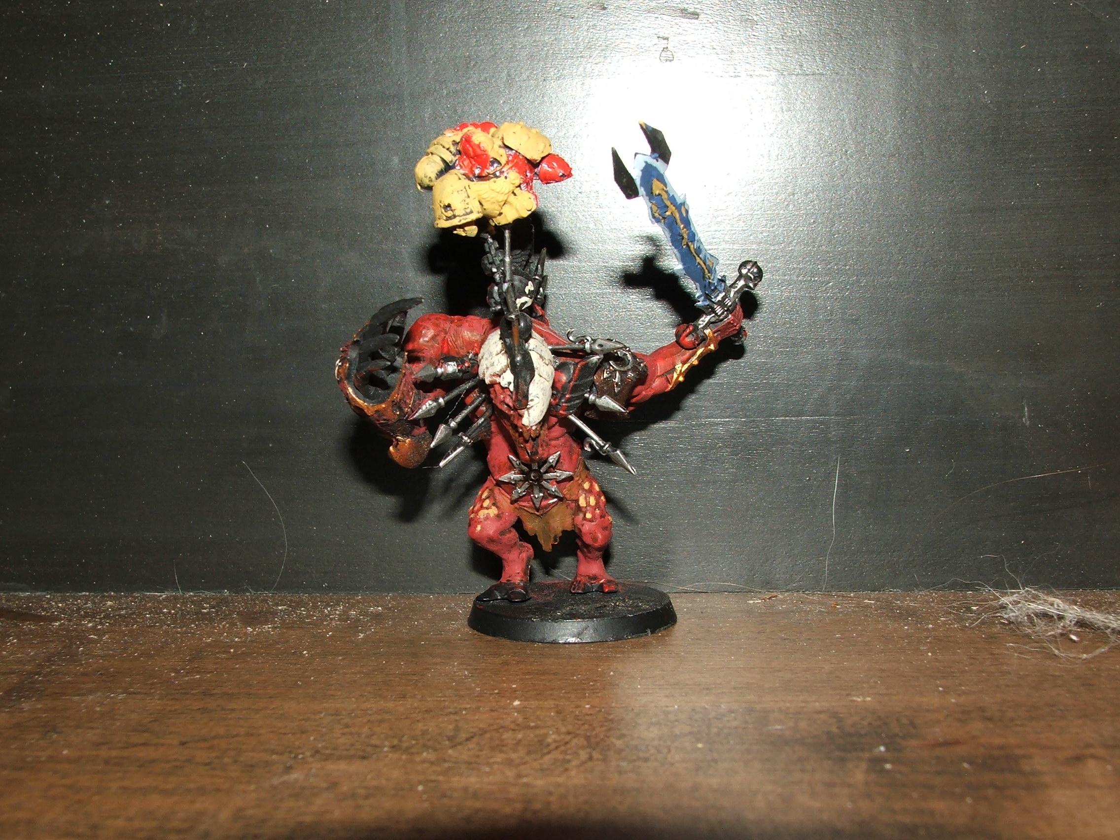 heres a beast i made of of bitz for my chaos forces. I know paint looks terrible