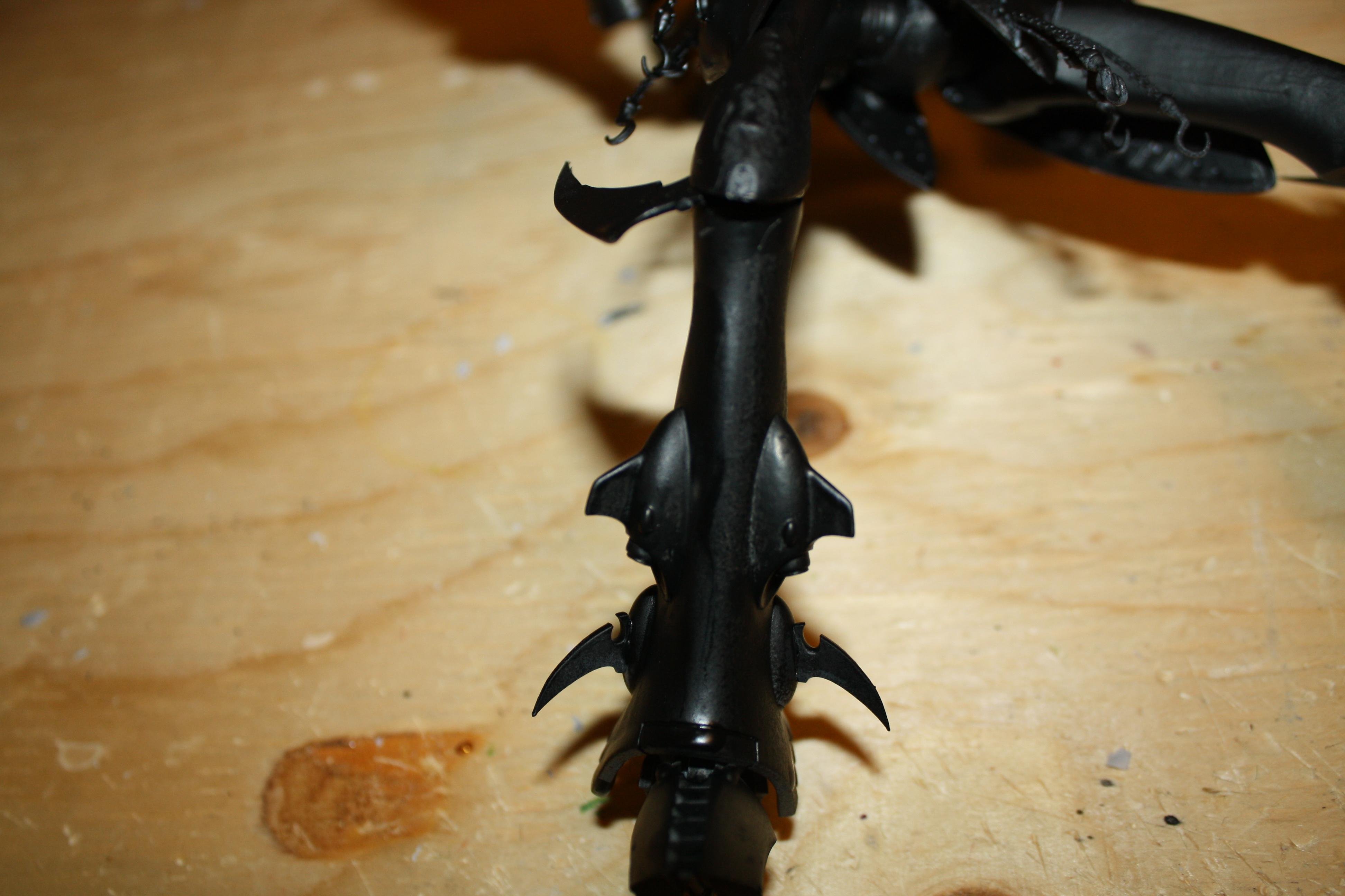 the leg. added blades on top of the gems, instead of trimming them, to preserve the structure of the leg