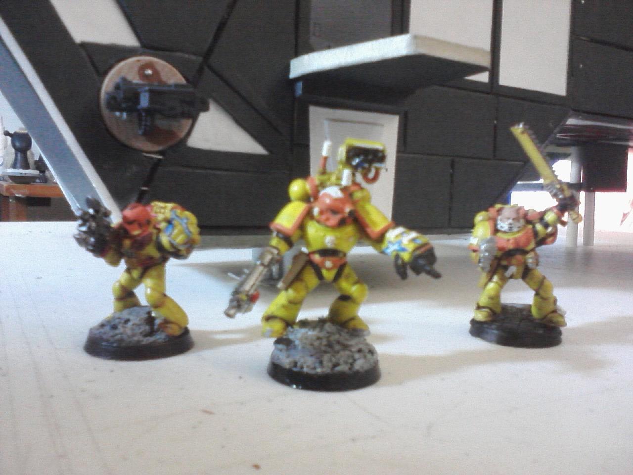 A close up of a few IF Marines with the Thunderhawk in the background