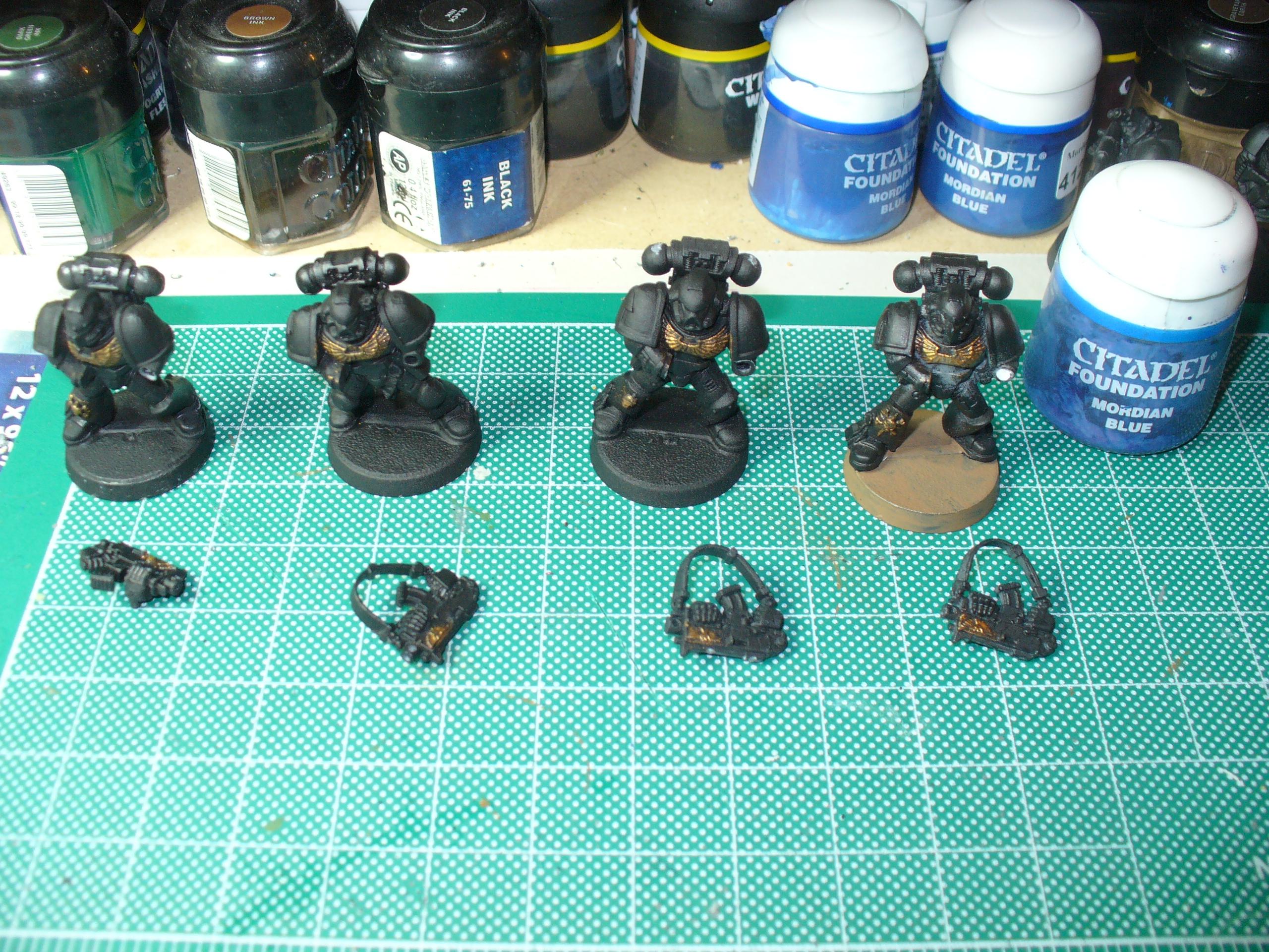 Bolter-armed Space Marines, everything gets undercoated black, these guys have Shining Gold dry brushed onto their chest eagles and a few other details