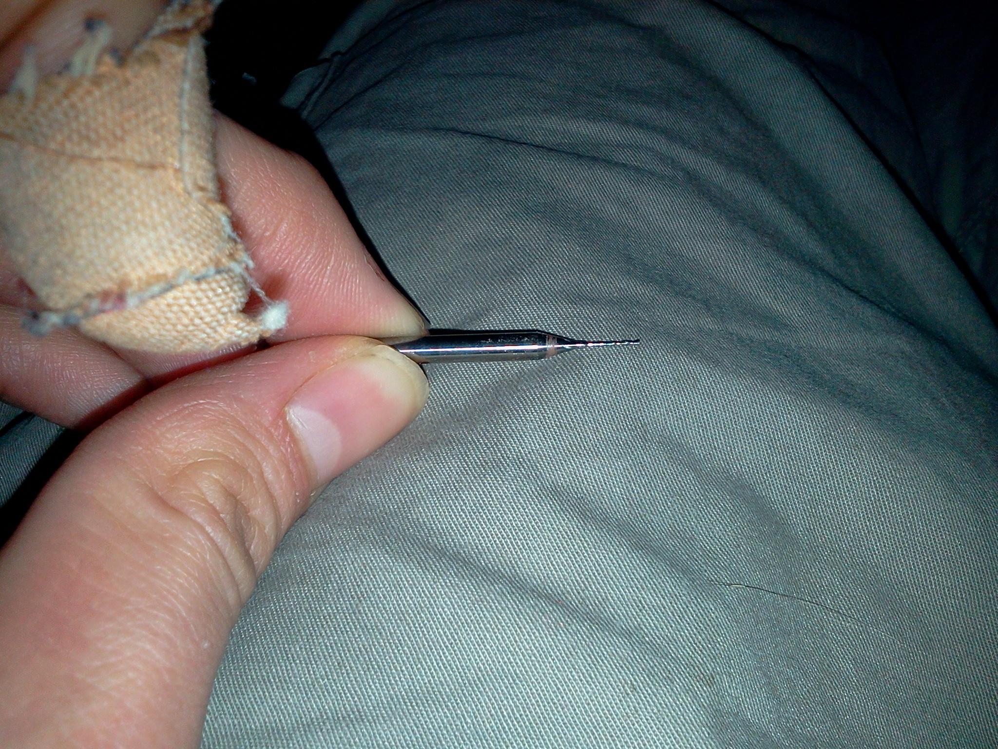 The 0.5mm bits we're using for the finishing pass. Plaster is from me scalpeling myself trying to scrape glue off the dread on the skull base. You know when you think "this could go really wrong..."
