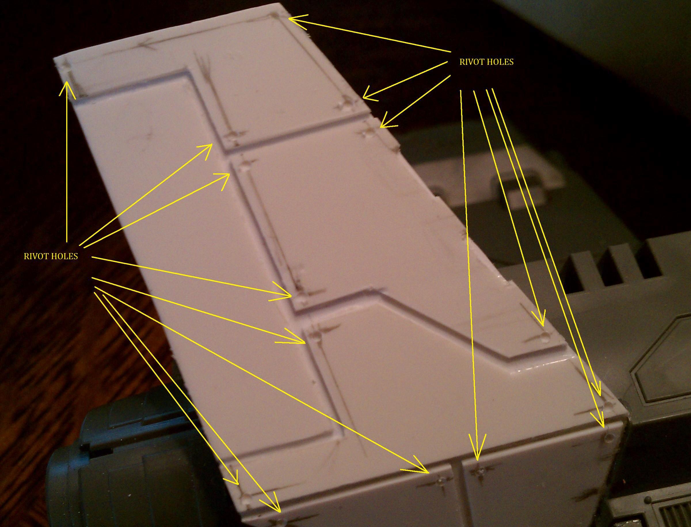 tail fins with pencil marks and holes