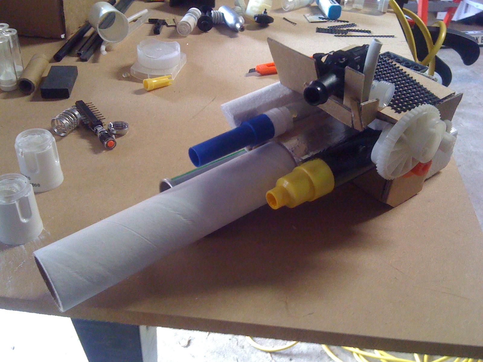 Front on view of the gun arm. Still a work in progress. I added a big gun to the platform on the top which can be seen better from different angles. Assorted tubes and other pipey objects serve as the massive guage cannons