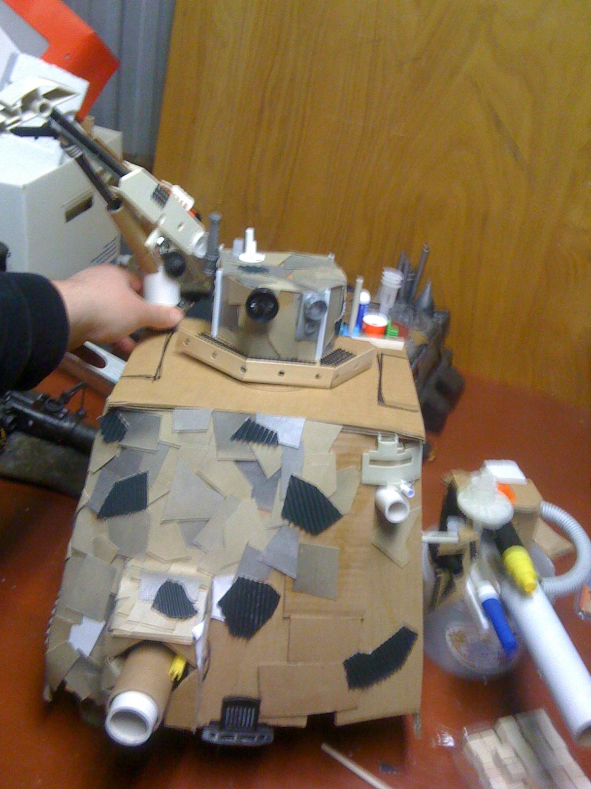 A blurry (oops) pic of how I am now imagining the lifta/droppa arm might sit on the shoulder. Placement in the back corner like that allows the head to still swivel 180 degrees. WINNING!