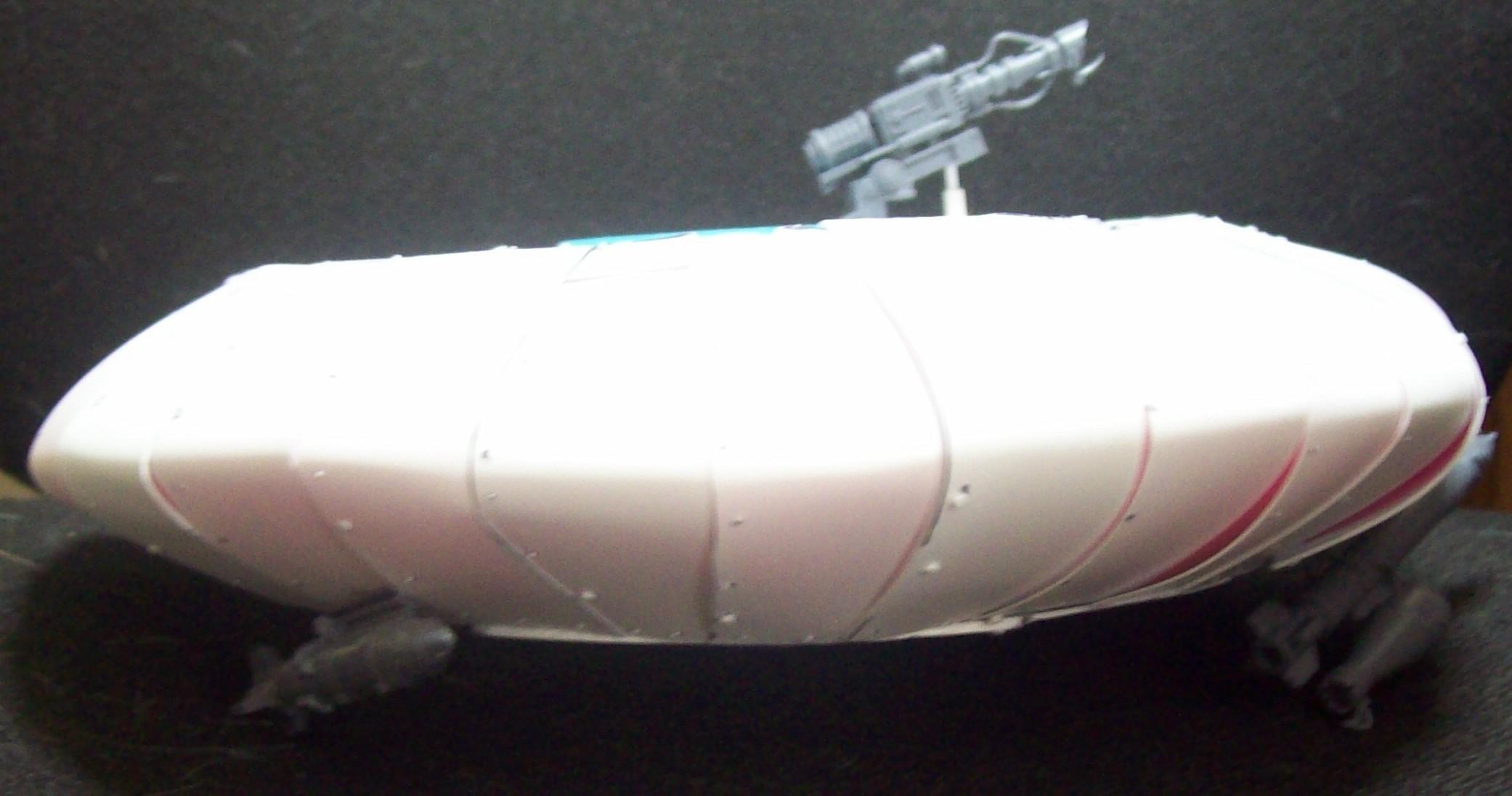 Other side of saucer with gun