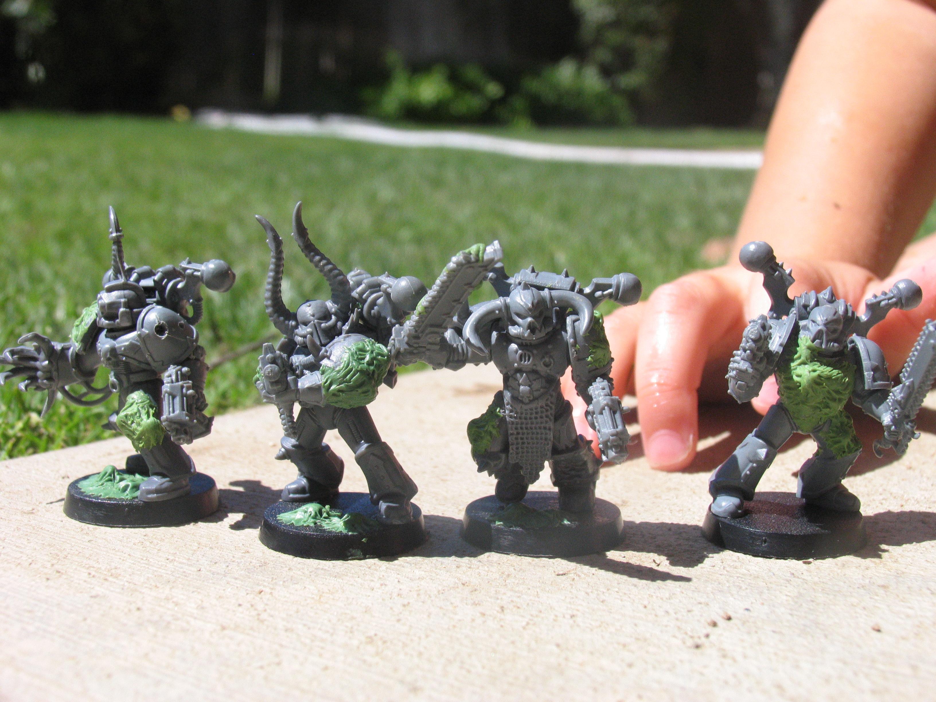 here are some infantry converted into plague marines. note the great unclean ones arm in the background (i'm sure she can rival papa nurgle in the smell dept.)