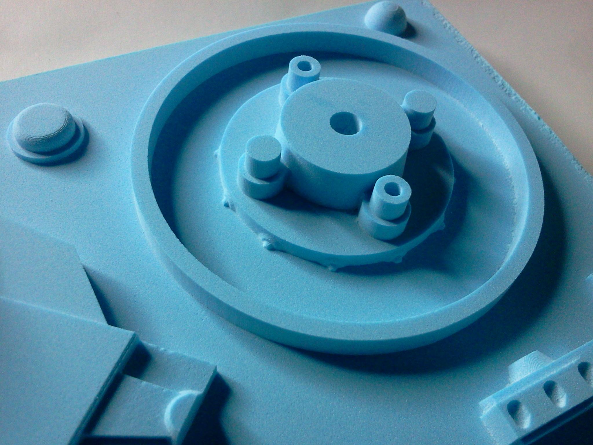 A close up of the main rotor bearing. Lots of tiny rivets around the edge and holes for the pins on the wing to fit in