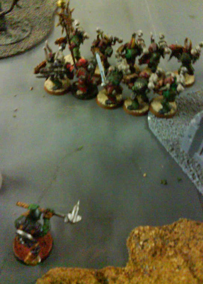 A triumphant tankhammer wielding tankbusta destroys a daemon prince and is gunned down by a firing squad