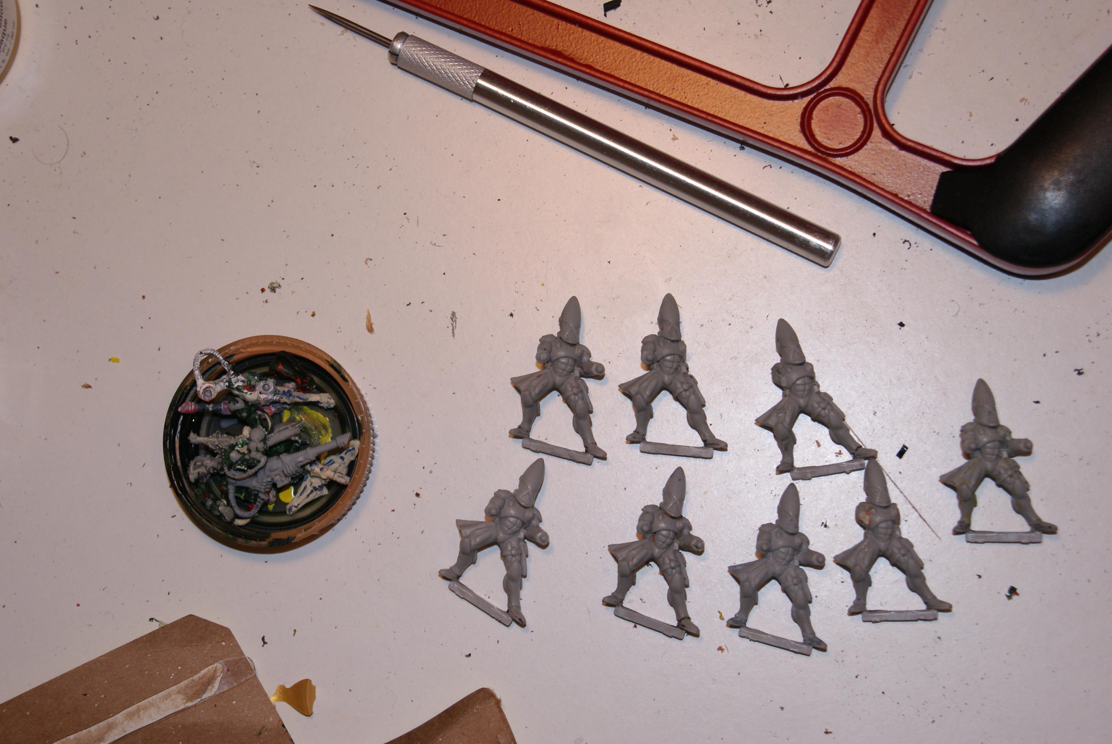the finished product, and a container of arm bits
