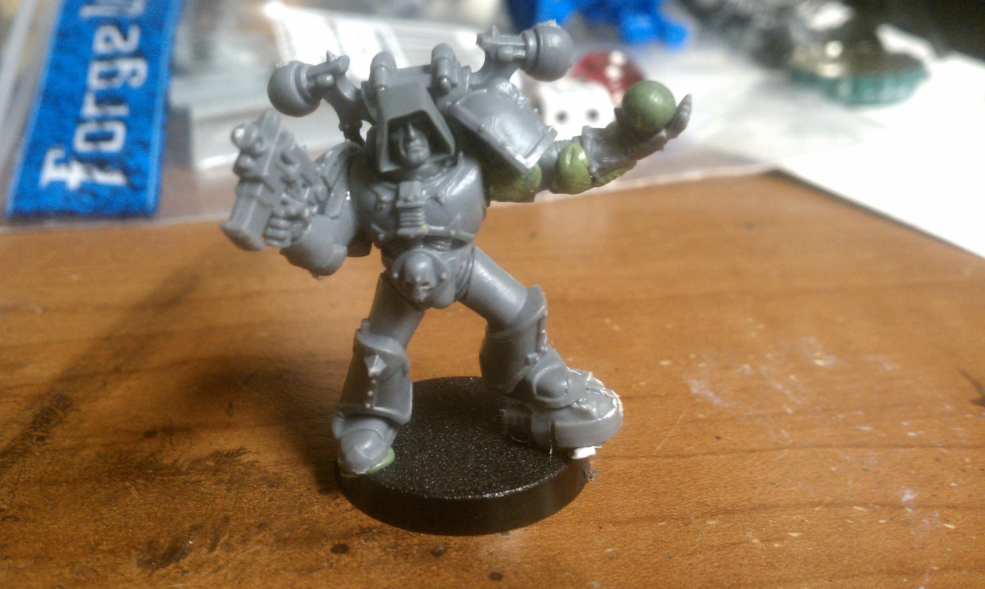 Xartis, standing on a space wolf helm