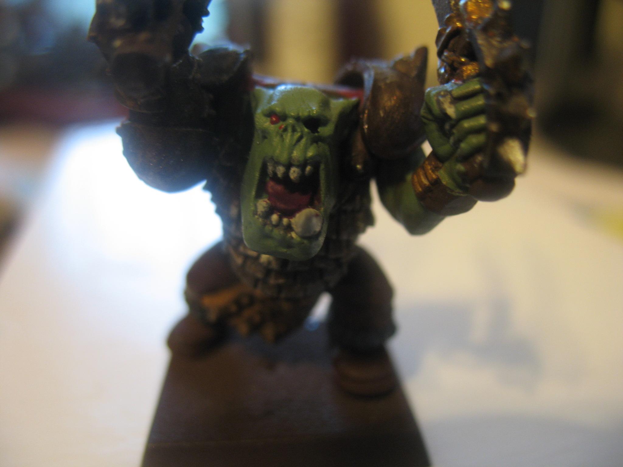 An Orc with a black orc arm grafted on