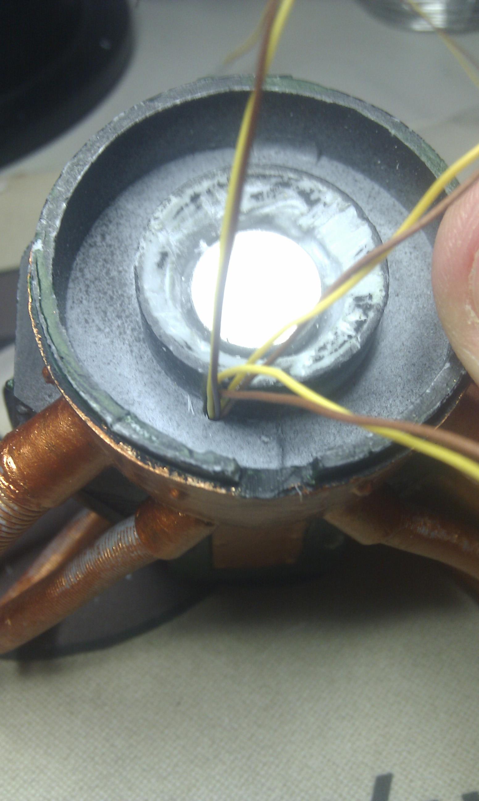 and out under the neck joint (also, a big magnet)